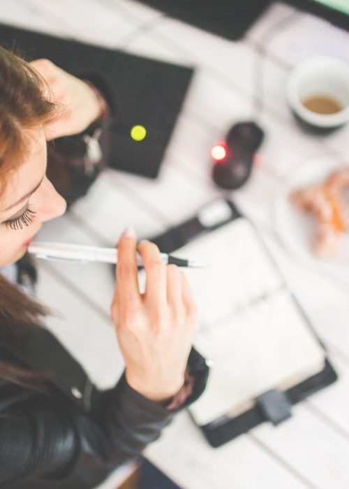 woman-hand-desk-office.jpg